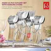 Anzio 24-piece gold-plated cutlery set on hanging stand, arranged on elegant dining table setup.